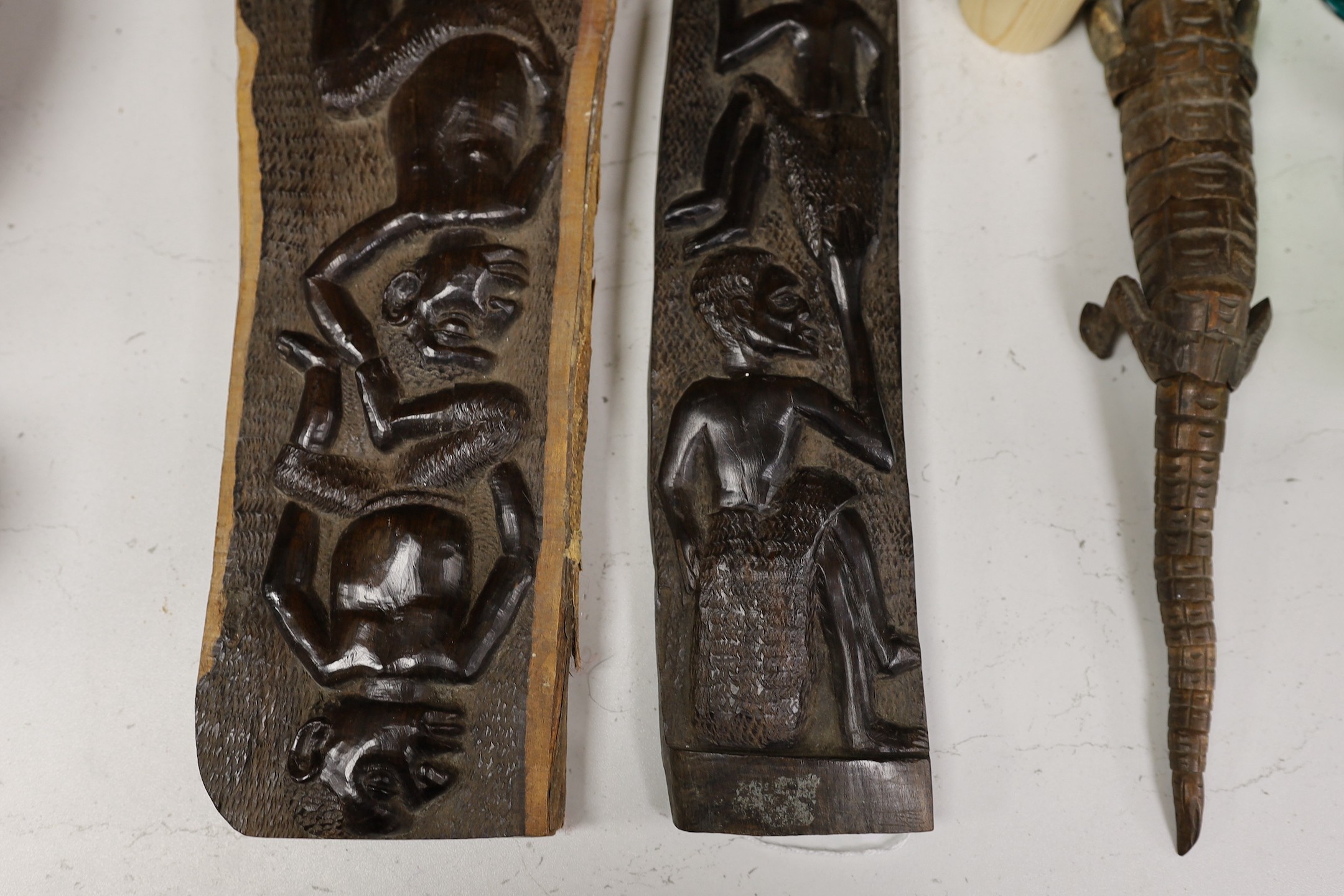 An interesting sectional wooden articulated crocodile, together with African wooden tribal carved totems, and other miscellaneous wooden items, tallest 53cm